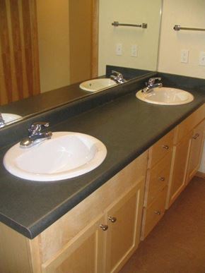 Seattle apartment for rent - a bathroom with two sinks and a mirror