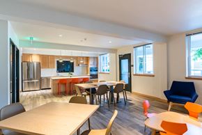 Seattle apartment for rent - A modern dining room with a long table and chairs.