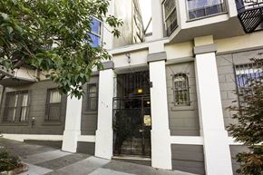 San Francisco apartment for rent - A building with a black gate and white columns.