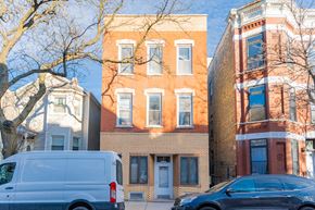Chicago apartment for rent - a white van parked in front of a brick building