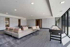 Bloomington apartment for rent - a game room with a foosball table and a pool table