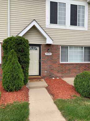 Chesterfield house for rent - a house with a white door and a sidewalk in front of it