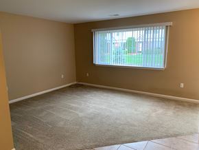 Chesterfield house for rent - an empty living room with a window and carpet