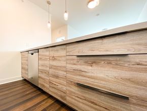 Somerset apartment for rent - a kitchen with wooden cabinets and a long counter top