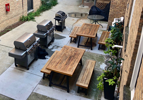 Chicago apartment for rent - a patio with picnic tables and barbecue grills