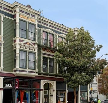 San Francisco apartment for rent - a building on a city street with a tree