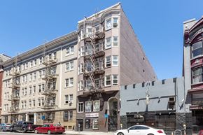 San Francisco apartment for rent - a building with a fire escape on the side of it on a city street