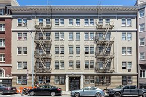 San Francisco apartment for rent - a large apartment building with a fire escape