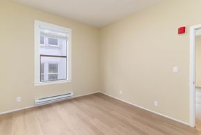 San Francisco apartment for rent - A room with a window and a radiator on the wall.