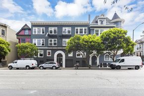 San Francisco apartment for rent - A row of houses with a white van parked in front of them.