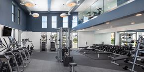 San Pedro apartment for rent - a gym filled with cardio machines and weights