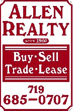 Manitou Springs apartment for rent - a red sign that reads buy sell trade lease
