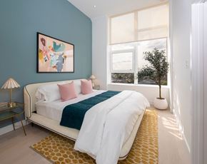 Philadelphia apartment for rent - a bedroom with a bed and a large window