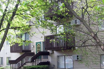 Three Rivers apartment for rent - the outside of a house with two balconies and a tree