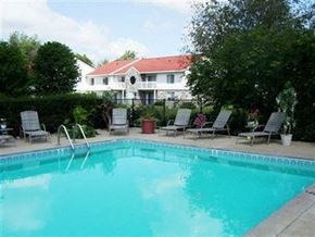 Portage apartment for rent - a large swimming pool with a house in the background