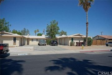 Cathedral City apartment for rent - A sunny day in a residential area with houses and parked cars.