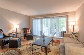 Twinsburg apartment for rent - a living room with a couch and chairs and a coffee table