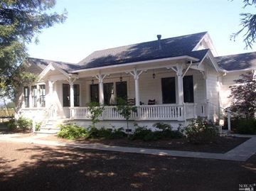 Fulton house for rent - a white house with a white porch and a black roof