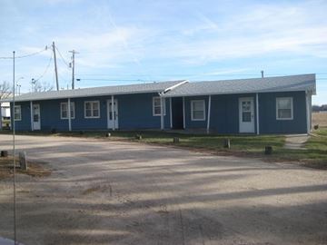 Kearney apartment for rent - a blue house with a road in front of it