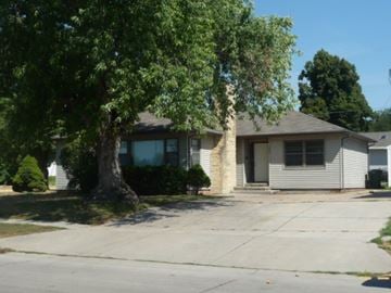 Kearney apartment for rent - a white house with a large tree in front of it