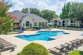 Grapevine apartment for rent - A large house with a pool in the backyard.