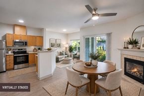 Redmond apartment for rent - A modern kitchen with a dining table and chairs.