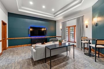 Redmond apartment for rent - A living room with a grey sofa and a glass coffee table.