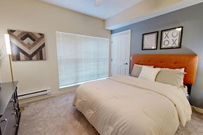 Redmond apartment for rent - The Lodge at Redmond Ridge apartments near Aerotek - Model bedroom with large windows
