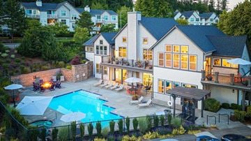 Issaquah townhouse for rent - A large house with a pool in the backyard.