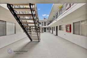 Hawthorne apartment for rent - a spiral staircase leads to the top floor of the building