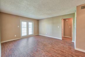 Port Arthur apartment for rent - an empty living room with a hard wood floor