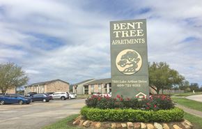 Port Arthur apartment for rent - the sign for bent tree apartments in front of a parking lot