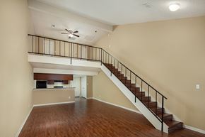 Port Arthur apartment for rent - an open living room with a staircase leading to the second floor