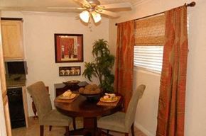 Westminster apartment for rent - A dining room with a table set for two and a potted plant.