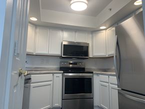 Indianapolis apartment for rent - a kitchen with white cabinets and stainless steel appliances