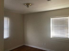 Snyder house for rent - A room with a window on the right and a light fixture on the ceiling.