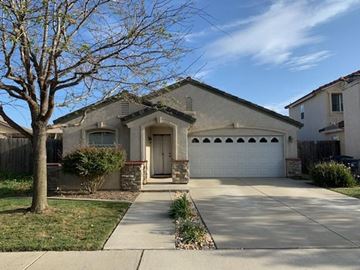 Santa Maria apartment for rent - A house with a white garage door and a tree in front.