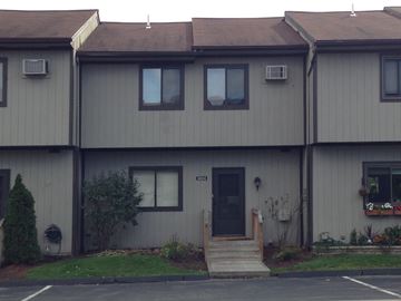 Hopewell Jct apartment for rent - A grey building with a black door and windows.