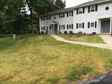Fishkill apartment for rent - A white house with a grey roof and a grey door.