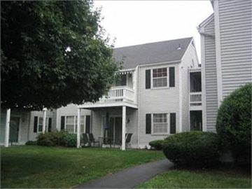 Fishkill apartment for rent - a white house with a sidewalk in front of it
