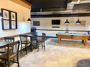 O'fallon apartment for rent - a game room with a pool table and tables