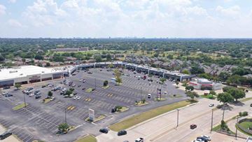 Carrollton apartment for rent - an aerial view of the parking lot of a shopping center