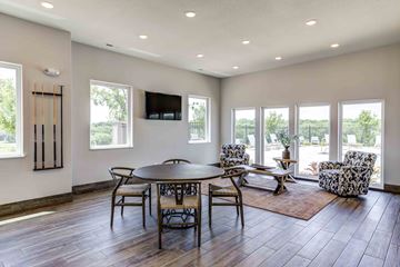 Lawrence apartment for rent - a living room with a table and chairs and a television
