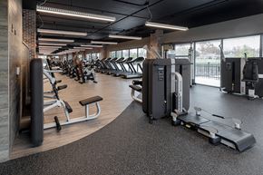 Lawrence apartment for rent - Apartments in Lawrence, KS - Fairway Flats - Fully Equipped Fitness Center With Strength Training Equipment, Cardio Machines, and Expansive Floor-to-Ceiling Windows.