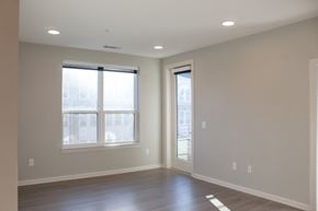 Spartanburg apartment for rent - a living room with a large window and wooden floors