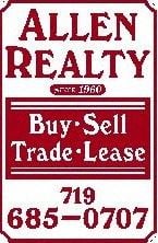 Woodland Park apartment for rent - a sign that reads buy sell trade lease