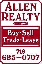 Colorado Springs apartment for rent - a sign that reads buy sell trade lease