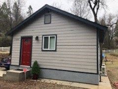Placerville apartment for rent - A small house with a red door and a window.