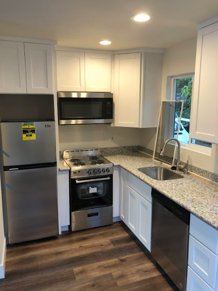 Placerville apartment for rent - A kitchen with a stainless steel refrigerator and a stainless steel oven.