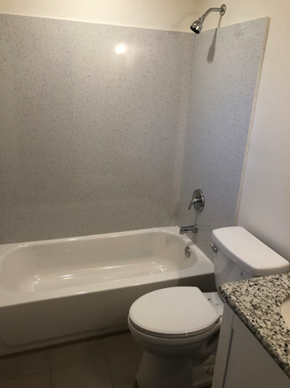Placerville apartment for rent - A white toilet sits next to a bathtub in a bathroom.